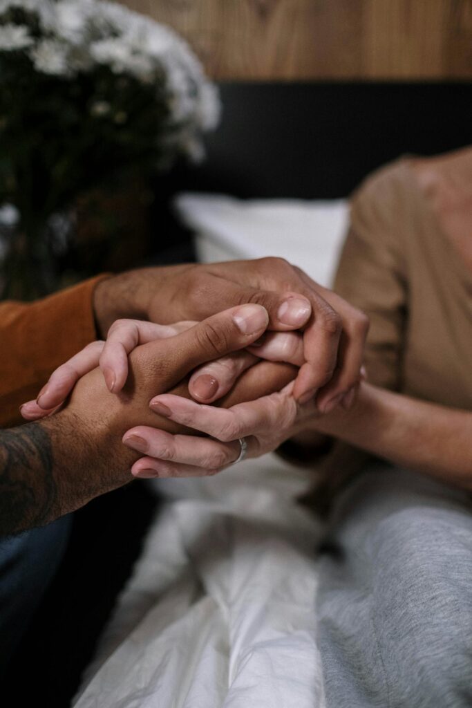 Hands held during a supportive conversation