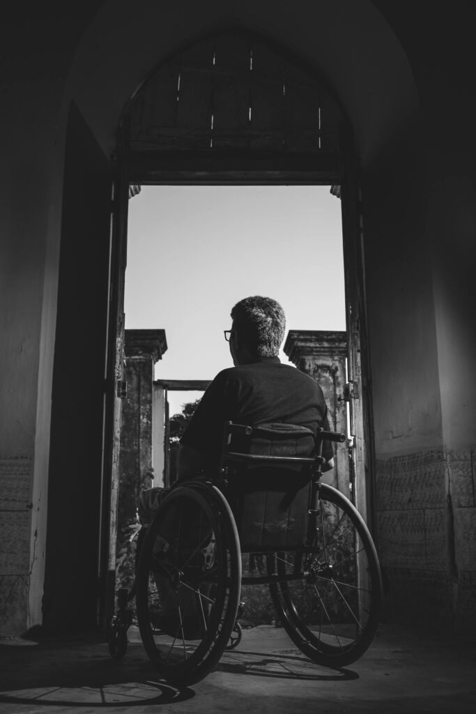 Wheelchair user approaching a doorway